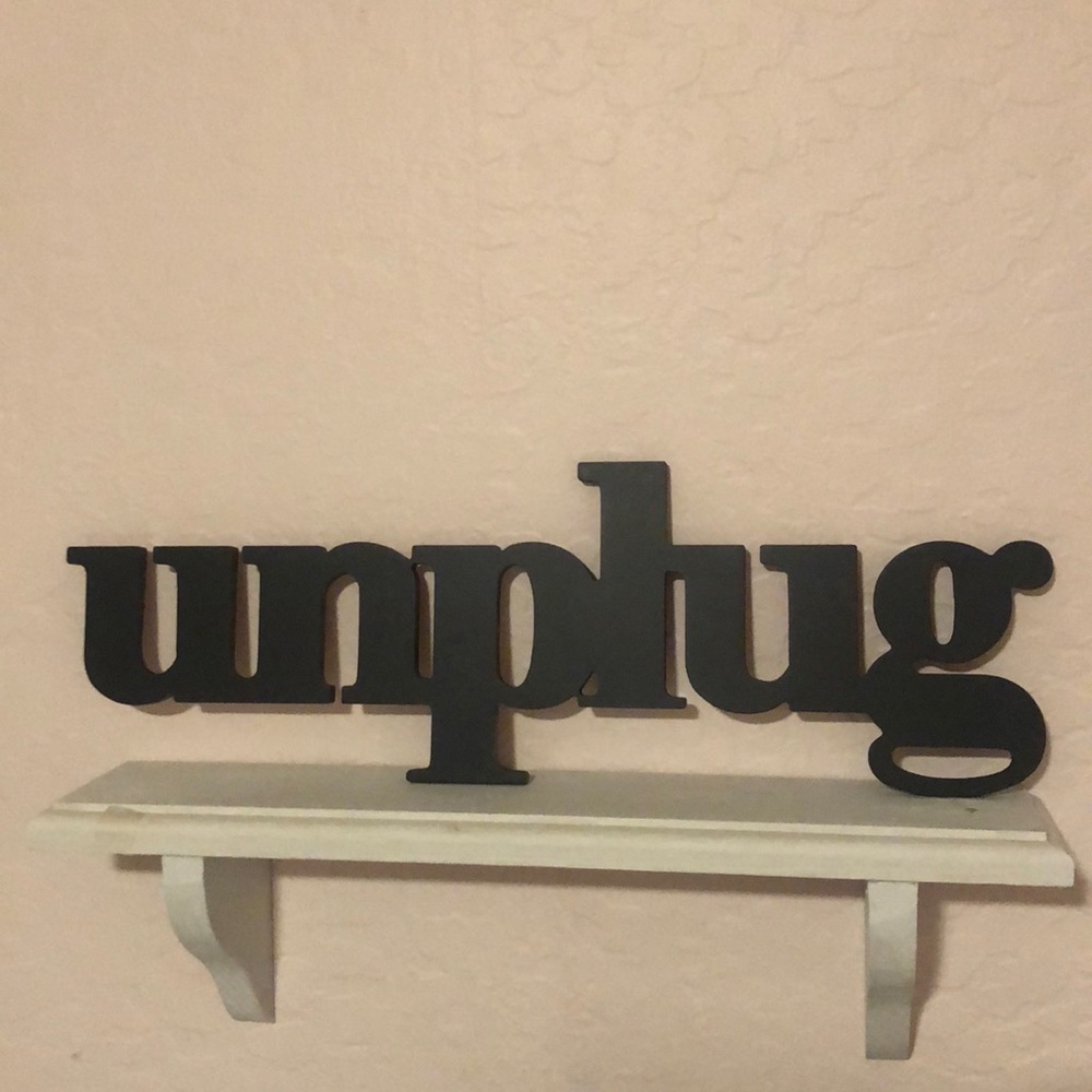 “Unplug” decorative wall sign